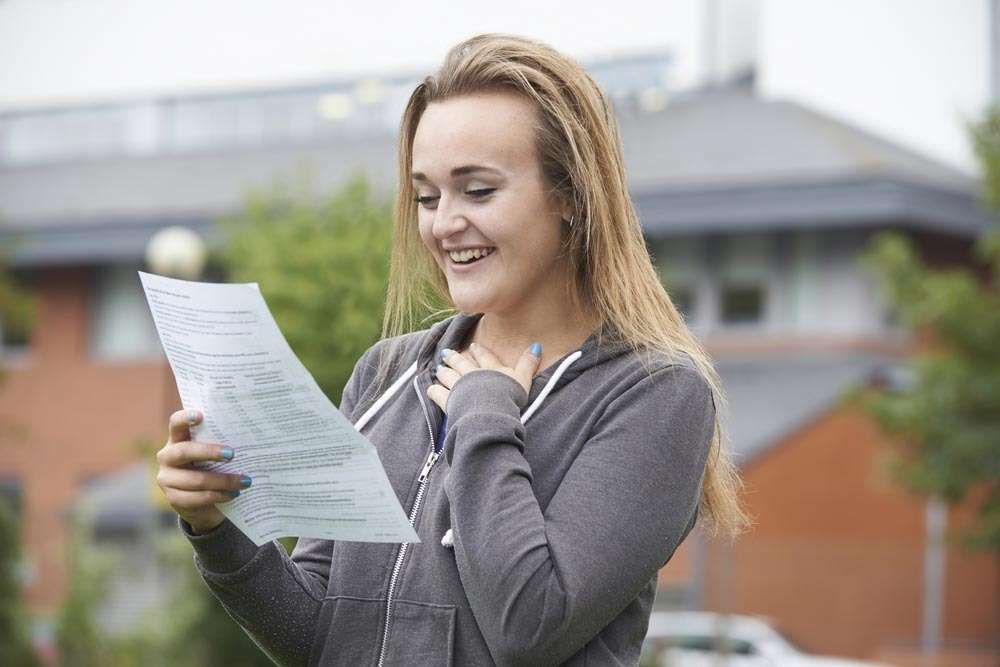 A student collects her GCSE results